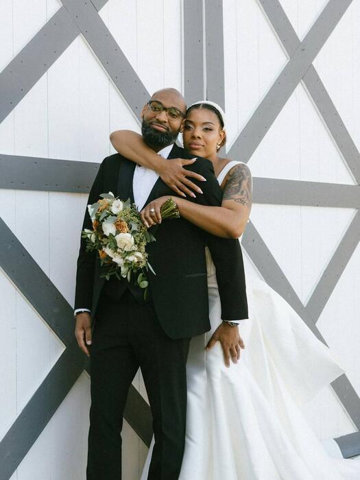 Couple embracing at their reception